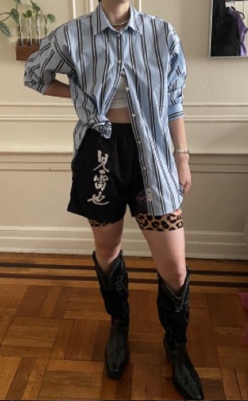 Chanel in a striped shirt and western boots