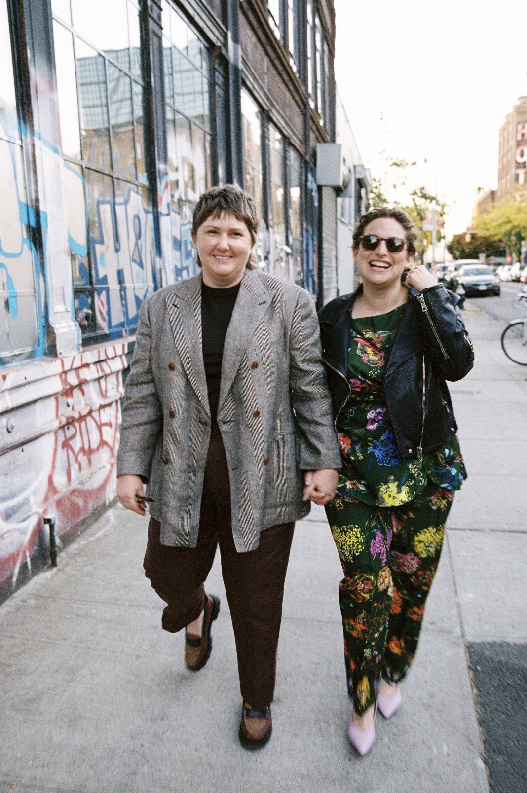 Estelle and Mackenzie walking hand in hand