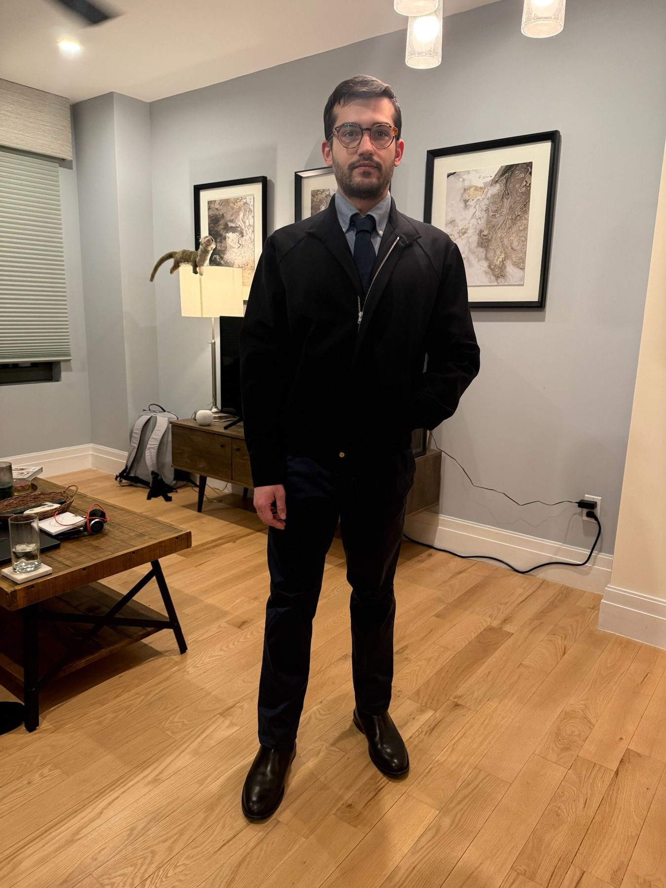 Nick in a navy tie and black jacket